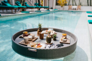 exotic lunch hotel outdoor shot table with fruits swimming pool scaled